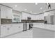 Bright kitchen with white cabinetry, stainless steel appliances, and stylish backsplash at 5277 Cardinal Nw Ln, Lilburn, GA 30047