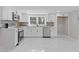 Modern kitchen featuring stainless steel appliances, quartz countertops, and a tiled backsplash at 5277 Cardinal Nw Ln, Lilburn, GA 30047