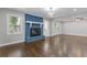 Cozy living room with a striking blue brick fireplace and gleaming hardwood floors at 5277 Cardinal Nw Ln, Lilburn, GA 30047
