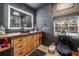 Modern bathroom with a unique vessel sink, wood countertop, and decorative mirror at 80 Rountree Rd, Riverdale, GA 30274