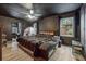 Bedroom featuring black walls, wood-look floors, and a comfy bed with a tent at 80 Rountree Rd, Riverdale, GA 30274