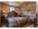 Rustic bedroom showcasing wood walls, stone accents, and a plush upholstered bed at 80 Rountree Rd, Riverdale, GA 30274