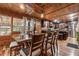 Open dining room showcasing wood walls, modern lighting, and connection to kitchen at 80 Rountree Rd, Riverdale, GA 30274