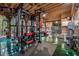 Home gym with modern equipment, wood ceiling, and natural light, creating a perfect fitness space at 80 Rountree Rd, Riverdale, GA 30274