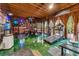 Spacious home gym with a variety of exercise equipment, green floors, and a great view of the outdoors at 80 Rountree Rd, Riverdale, GA 30274