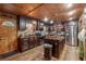 Warm wood kitchen featuring stone countertops, stainless steel appliances, and abundant cabinetry at 80 Rountree Rd, Riverdale, GA 30274