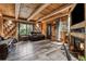 Wood paneled living room with hard wood floors, leather couches, fireplace, and decorative accents at 80 Rountree Rd, Riverdale, GA 30274