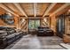 Wood paneled living room with hard wood floors, leather couches, and decorative mirror at 80 Rountree Rd, Riverdale, GA 30274