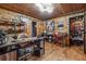Rustic office featuring wooden walls, shelving units and industrial-style desk at 80 Rountree Rd, Riverdale, GA 30274