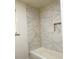 Beautifully tiled shower with niche in remodeled bathroom at 1332 Willis Mill Sw Rd, Atlanta, GA 30311