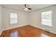 Bright bedroom features hardwood floors and natural light from updated windows at 1332 Willis Mill Sw Rd, Atlanta, GA 30311