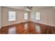 Bedroom features hardwood floors and natural light from updated windows at 1332 Willis Mill Sw Rd, Atlanta, GA 30311