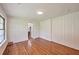 Spacious bedroom features hardwood floors and updated windows with natural light at 1332 Willis Mill Sw Rd, Atlanta, GA 30311