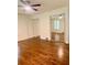 This spacious bedroom features hardwood floors, a ceiling fan, and sliding closet doors at 1332 Willis Mill Sw Rd, Atlanta, GA 30311