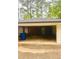The property features an open carport, brick structure, and a storage space at 1332 Willis Mill Sw Rd, Atlanta, GA 30311