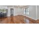 Bright dining area with stainless steel refrigerator, hardwood floors, and lots of natural light from large windows at 1332 Willis Mill Sw Rd, Atlanta, GA 30311