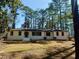 Charming single-story home with a freshly painted exterior and mature trees at 1332 Willis Mill Sw Rd, Atlanta, GA 30311