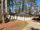 Detached garage with white brick and a large garage door at 1332 Willis Mill Sw Rd, Atlanta, GA 30311