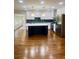 Spacious open-concept kitchen with dark backsplash, stainless appliances, and center island at 1332 Willis Mill Sw Rd, Atlanta, GA 30311