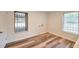 Bright laundry room with vinyl plank floors, fresh paint, and natural light from two large windows at 1332 Willis Mill Sw Rd, Atlanta, GA 30311