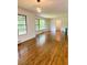 Living room featuring hardwood floors and large windows, letting in natural light at 1332 Willis Mill Sw Rd, Atlanta, GA 30311