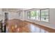 Bright living room with large windows, hardwood floors, and an open layout creates an airy and inviting space at 1332 Willis Mill Sw Rd, Atlanta, GA 30311