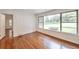 Inviting living room with hardwood floors and natural light from large picture windows showcasing the outdoor scenery at 1332 Willis Mill Sw Rd, Atlanta, GA 30311