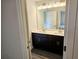 Modern bathroom featuring a dual sink vanity, ample counter space, and updated fixtures at 145 Scarlett Place Dr, Bowdon, GA 30108