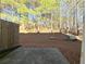 Backyard featuring wooded views and a concrete patio at 3275 Wild Basil Ln, Buford, GA 30519