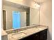 Bathroom featuring a double vanity with granite counters at 3275 Wild Basil Ln, Buford, GA 30519