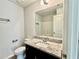 Bathroom featuring granite countertops, a toilet, and a shower at 3275 Wild Basil Ln, Buford, GA 30519