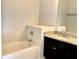 Bathroom with a tub and vanity featuring granite counters at 3275 Wild Basil Ln, Buford, GA 30519