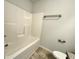 Bright bathroom with a white bathtub and shower combination at 3275 Wild Basil Ln, Buford, GA 30519