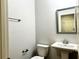 Powder room featuring pedestal sink, square mirror, and chrome hardware at 3275 Wild Basil Ln, Buford, GA 30519