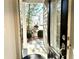 Charming view from the open front door, showcasing the welcoming exterior and landscaped yard at 3275 Wild Basil Ln, Buford, GA 30519