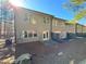 Back exterior view showing a small patio and wooded views at 3275 Wild Basil Ln, Buford, GA 30519