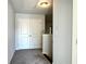 Upstairs hallway with carpet flooring leading to rooms and a closet at 3275 Wild Basil Ln, Buford, GA 30519