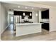 Modern kitchen features stainless steel appliances, granite countertops, and a spacious island at 3275 Wild Basil Ln, Buford, GA 30519