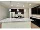 Spacious kitchen with a large island, granite countertops, and stainless steel appliances at 3275 Wild Basil Ln, Buford, GA 30519