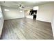 Bright and airy living room with continuous flooring leading to the kitchen at 3275 Wild Basil Ln, Buford, GA 30519