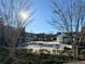 Community pool area surrounded by trees at 3275 Wild Basil Ln, Buford, GA 30519
