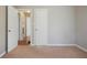 Bedroom with neutral walls, carpet floors, and natural light coming in from the entryway at 5812 Dogwood Cir, Austell, GA 30168