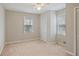 Cozy bedroom with neutral paint, carpet, two windows, and a closet that maximizes space at 5812 Dogwood Cir, Austell, GA 30168