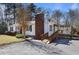 View of the exterior with a brick chimney and wooden ramp that leads to the front of the house at 5812 Dogwood Cir, Austell, GA 30168