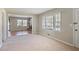 Cozy living room with hardwood flooring and views of the brick fireplace and backyard at 5812 Dogwood Cir, Austell, GA 30168