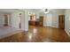 Open concept living space featuring hardwood floors connecting the living room to the kitchen at 5812 Dogwood Cir, Austell, GA 30168