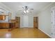 Living area with hardwood floors, ceiling fan, and views of the kitchen at 5812 Dogwood Cir, Austell, GA 30168