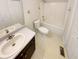 Bathroom with a white vanity, toilet, and shower/tub combination at 832 Overlook Trl, Canton, GA 30115
