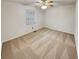 Bedroom with carpet, a ceiling fan, and a window providing natural light at 832 Overlook Trl, Canton, GA 30115
