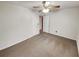 A cozy bedroom featuring neutral carpet and a ceiling fan at 832 Overlook Trl, Canton, GA 30115